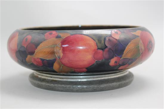 A William Moorcroft pomegranate pattern Tudric pewter mounted bowl, c.1920, 22cm, mount loose